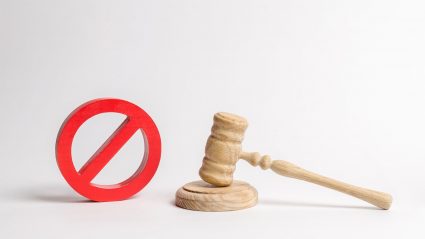 banned sign and wooden gavel