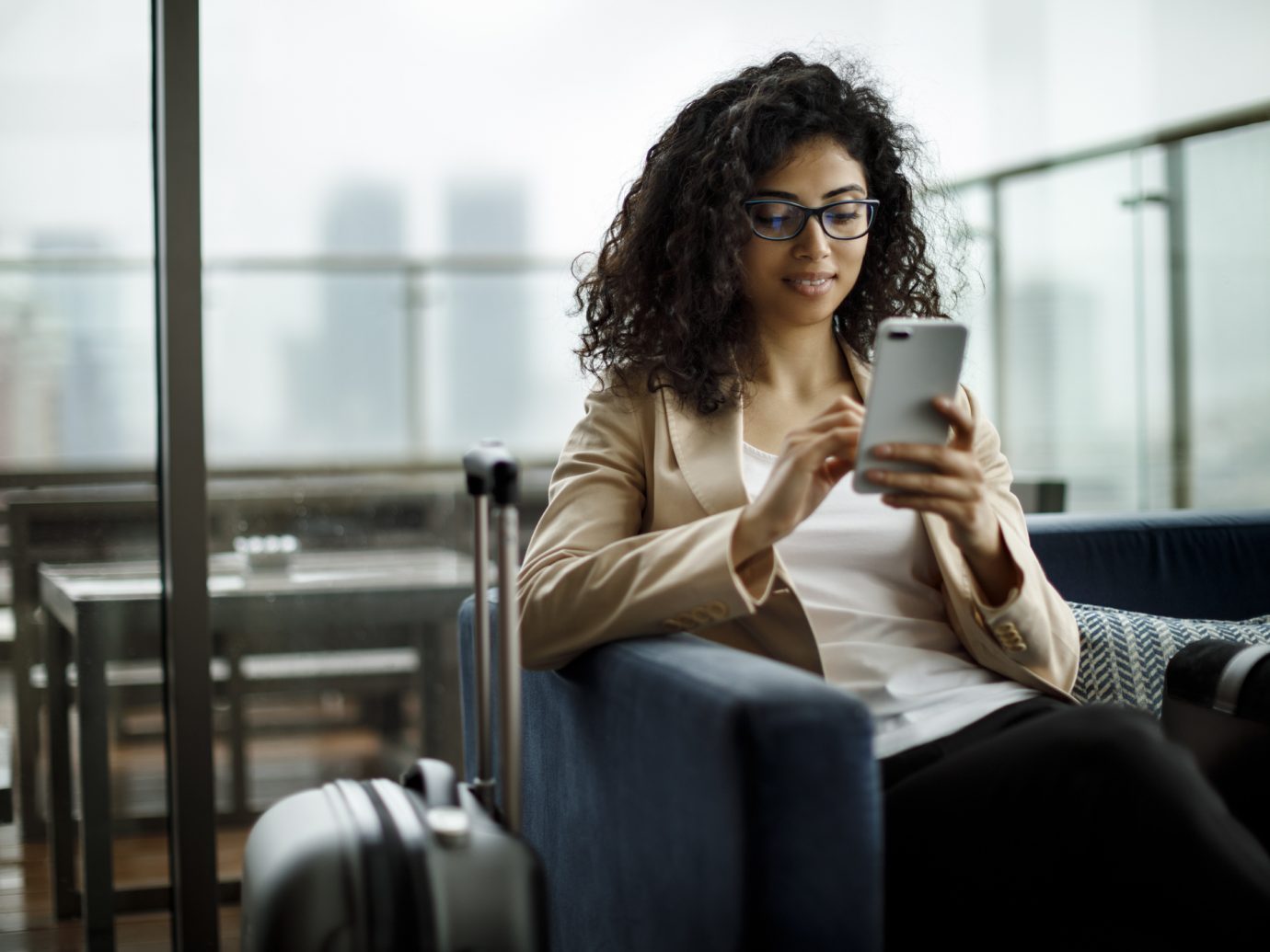 Woman in hotel looking at phone