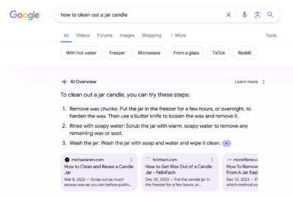 Screenshot of a Google search page showing an AI overview result at the top of the page. The result explains how to clean wax out of a jar candle and links related sources